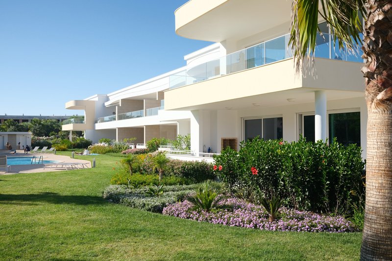 Apartment building with garden and swimming pool